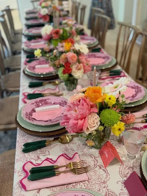 A spring table set with flowers and patterned plates
