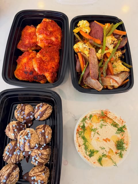 Harissa chicken thighs with curried spring vegetables and hummus